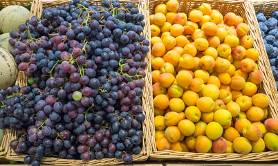 Grapes and yellow plums