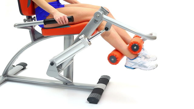 Closeup of young woman on hydraulic exerciser