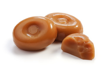 Caramel candies on white
