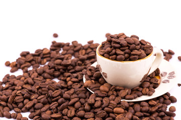 Coffee beans and cup of coffee background