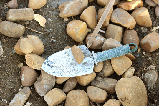 pebbles and trowel