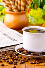 Coffee cup with fresh coffe beans for breakfast