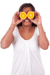 Young happy indian woman holding  orange slices