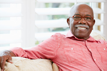 Portrait Of Happy Senior Man At Home - obrazy, fototapety, plakaty