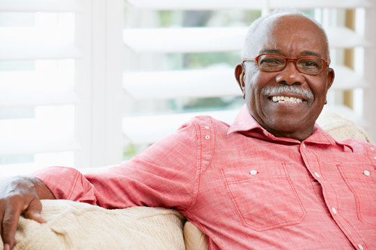Portrait Of Happy Senior Man At Home - Powered by Adobe