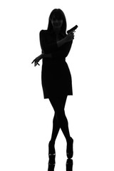 sexy detective  woman holding aiming  gun silhouette