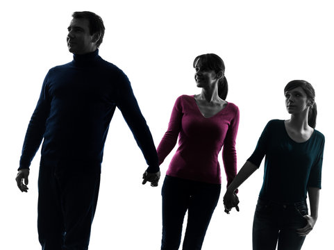 family father mother daughter walking holding hands silhouette