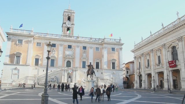 tourists at Palazzo Senatorio on a sunny day in Rome, Italy