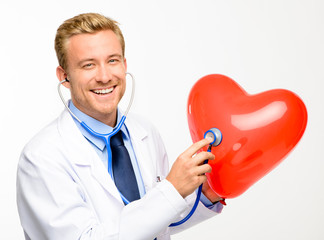 Doctor holding heart on white background