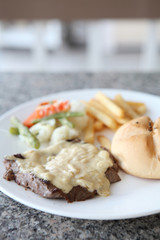 Beef steak with white sauce