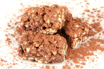 Chocolate sweets with cocoa, isolated on white