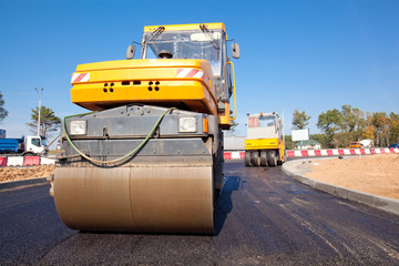 Road rollers during asphalt paving works