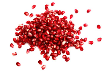 Pomegranate seeds on a white background.