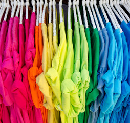 Colorful t-shirt on hangers