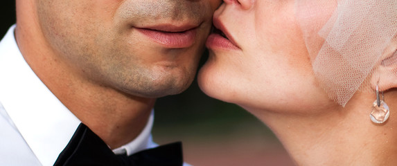 close up portrait of young caucasian couple kissing