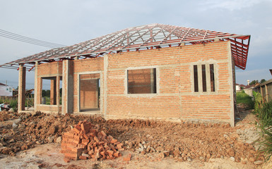 house under building with clay brick