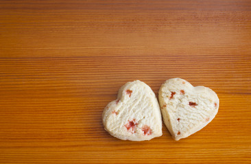 Love hearts strawberry shortcakes on a wooden table