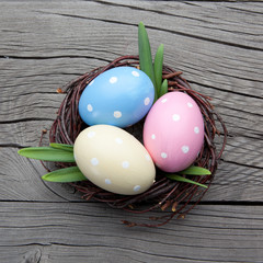 Obraz na płótnie Canvas Colorful easter eggs in a nest