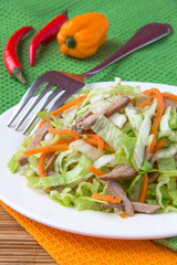 Crispy salad with pork, korean carrots and lettuce