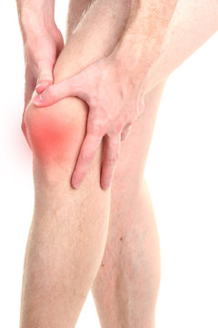 Man holding sore knee, isolated on white
