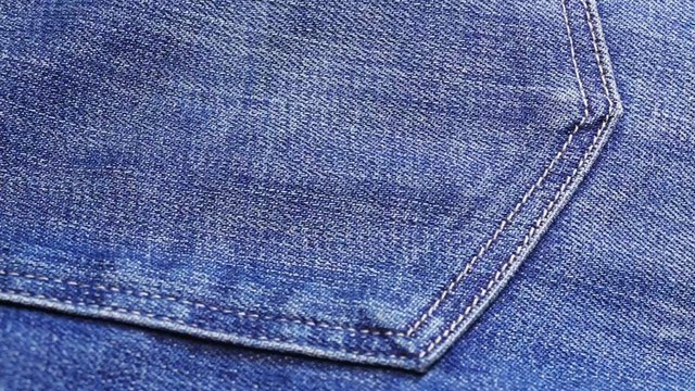 Blue jeans cloth background, sliding video