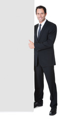 Businessman presenting empty banner