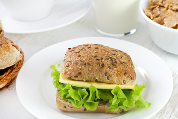 bread with cheese and lettuce on the plate