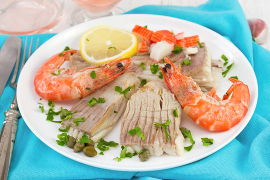 boiled fish with shrimps amd lemon