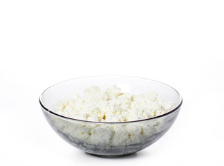 Bowl of cottage cheese on a white background