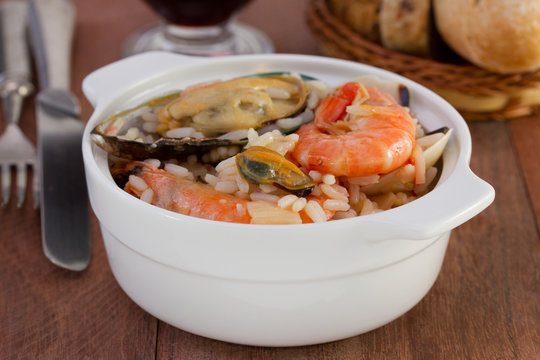 rice with seafood in the white bowl