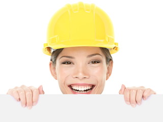 Construction worker / engineer woman showing sign