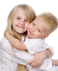 Smiling young brother and sister.