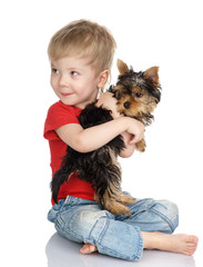 Stock Photo: child and yorkshire terrier. isolated on white
