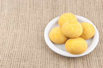cookies  in a white plate on a background of burlap