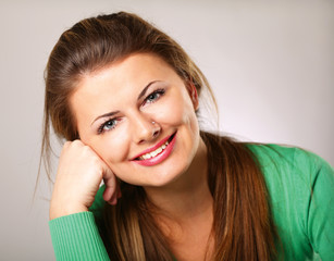 A beautiful woman sitting on the desk