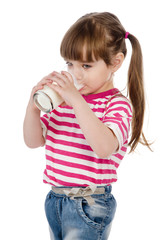 little girl drinking milk. isolated on white