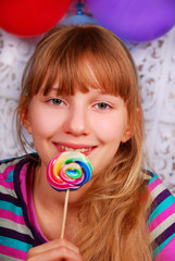 young girl with lollipop