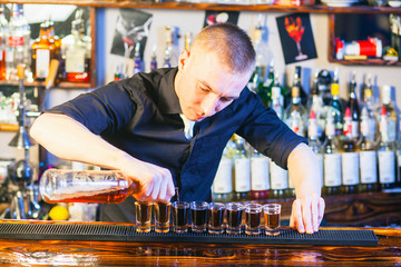 barman making  drink shots