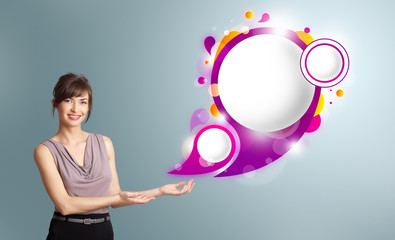Attractive woman presenting abstract speech bubble copy space
