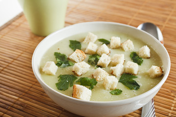 broccoli and potato croutons cream soup in a plate