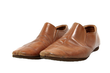 Old brown shoes pair isolated on white