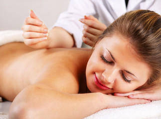 Fototapeta na wymiar Closeup of an attractive young woman receiving massage