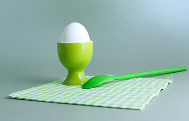 cup with egg  and spoon