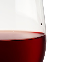 Close-up of red wine and glass focus on the rim.