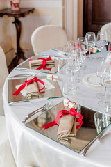 Wedding reception table set awaiting guests and food.