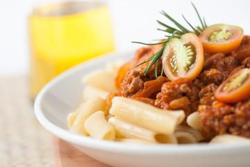 pasta penne bolognese with tomato and meat sauce