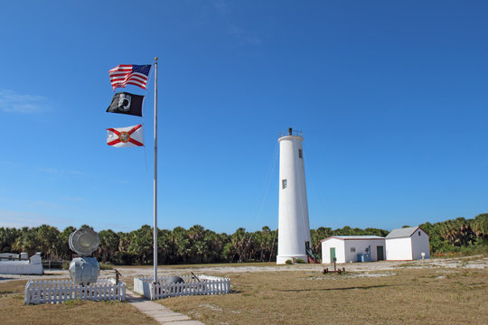 The Egmont Key lighthouse and flags in Tampa Bay, Florida