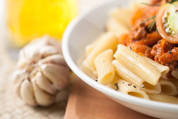 pasta penne bolognese with tomato and meat sauce