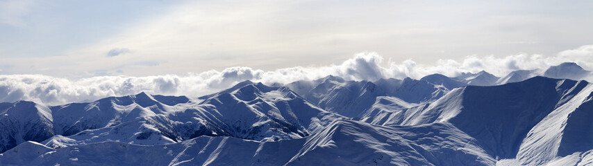 Naklejka premium Panorama of evening mountains in haze