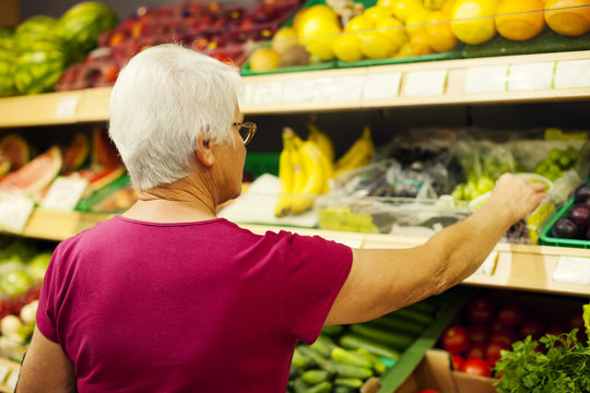 Senior woman at supermarket.